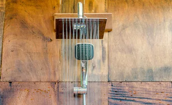 Rain Shower head on brown tiles