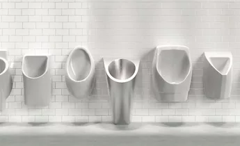 Row of various white water saving urinals