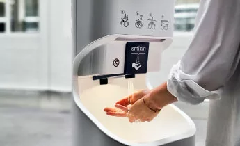 Female hands washing with the Smixin Hand Washing Machine