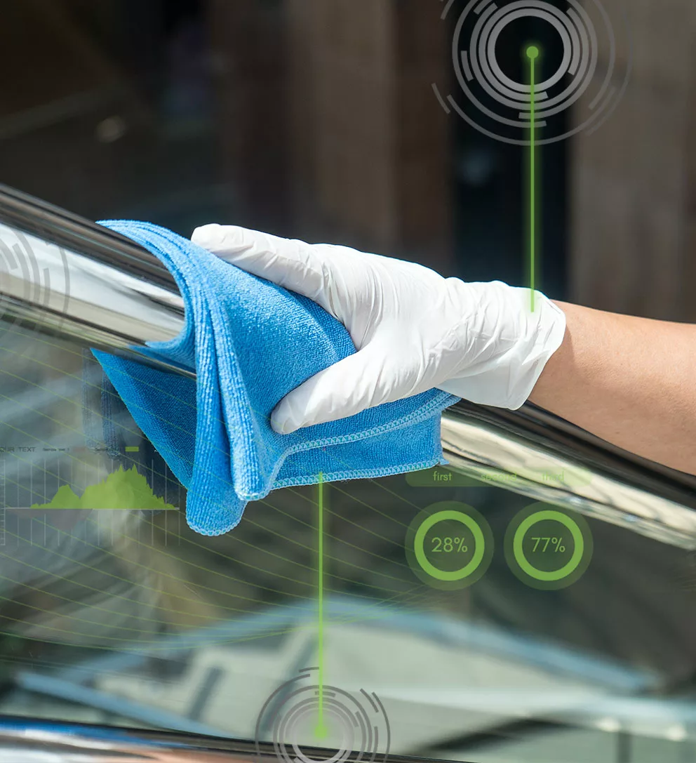 Hand Wiping railing using blue cloth and wearing glove