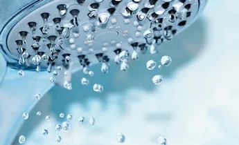 Close up of water saving shower head
