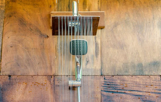 Rain Shower head on brown tiles