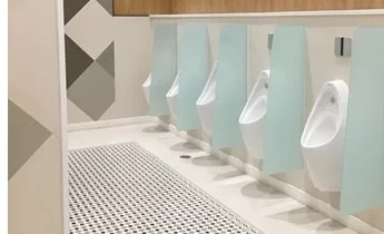 row of urinals in public WC